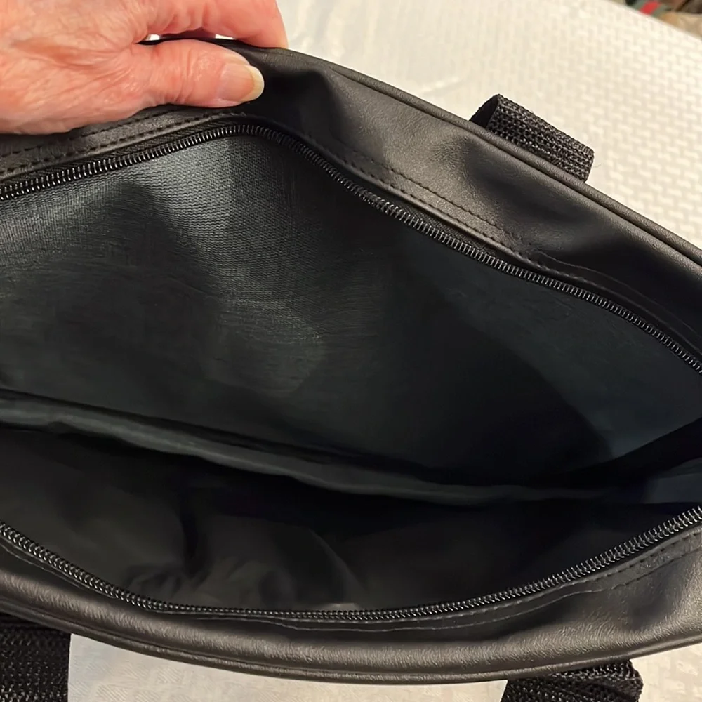 Briefcase, Black, Handles and Shoulder Straps lots of storage.